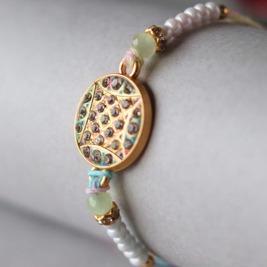 Pastel Mandala Rakhi – A Thread of Harmony & Light