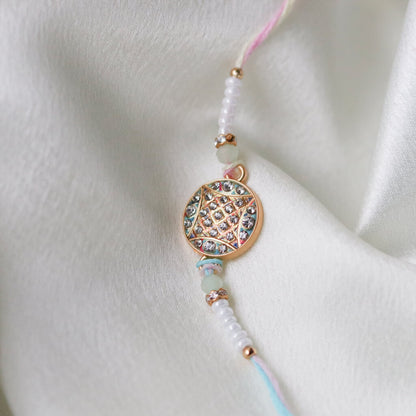 Pastel Mandala Rakhi – A Thread of Harmony & Light